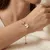 Armband in edelstaal met vlinders en zirkonia's