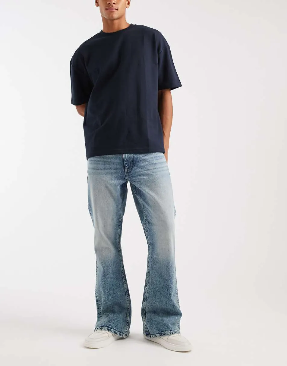 ASOS DESIGN flared jeans in light wash blue