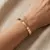Armband in edelstaal, hartjes en zirkonia