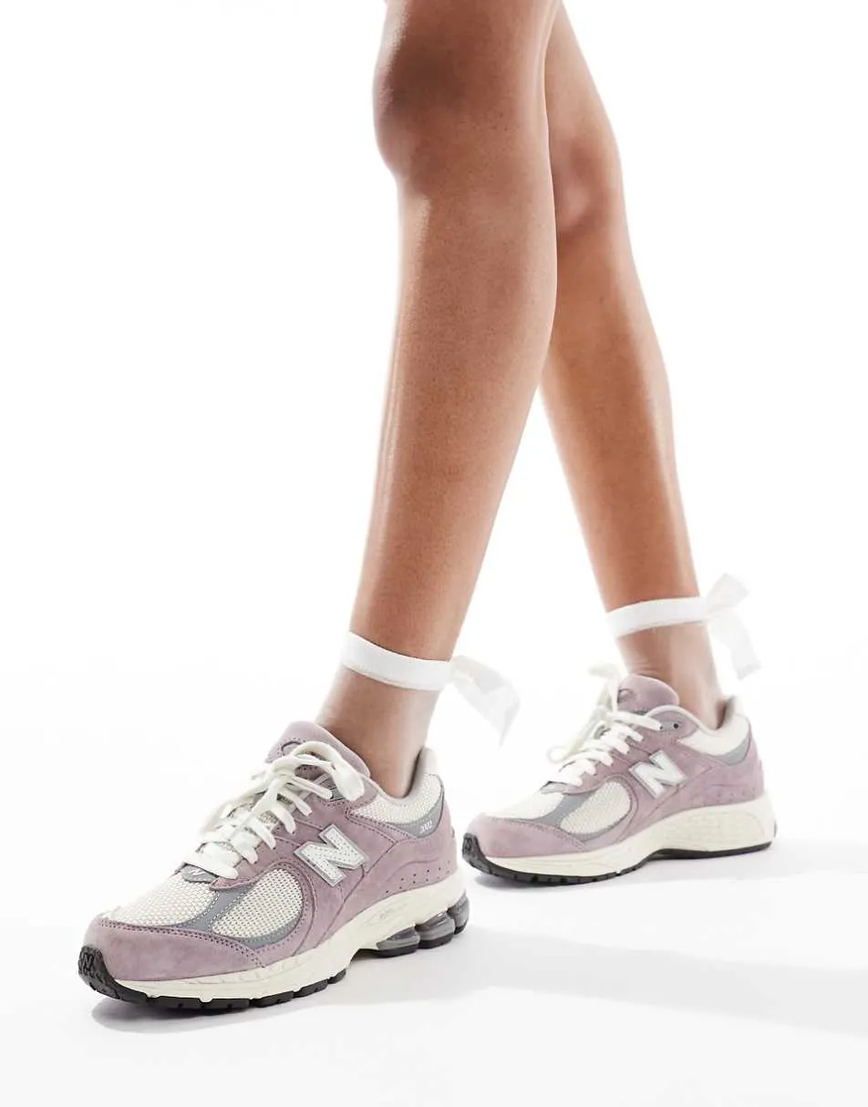 New Balance 2002r unisex trainers in beige and purple