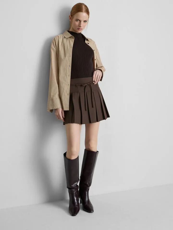 Mini-jupe plissée à ceinture