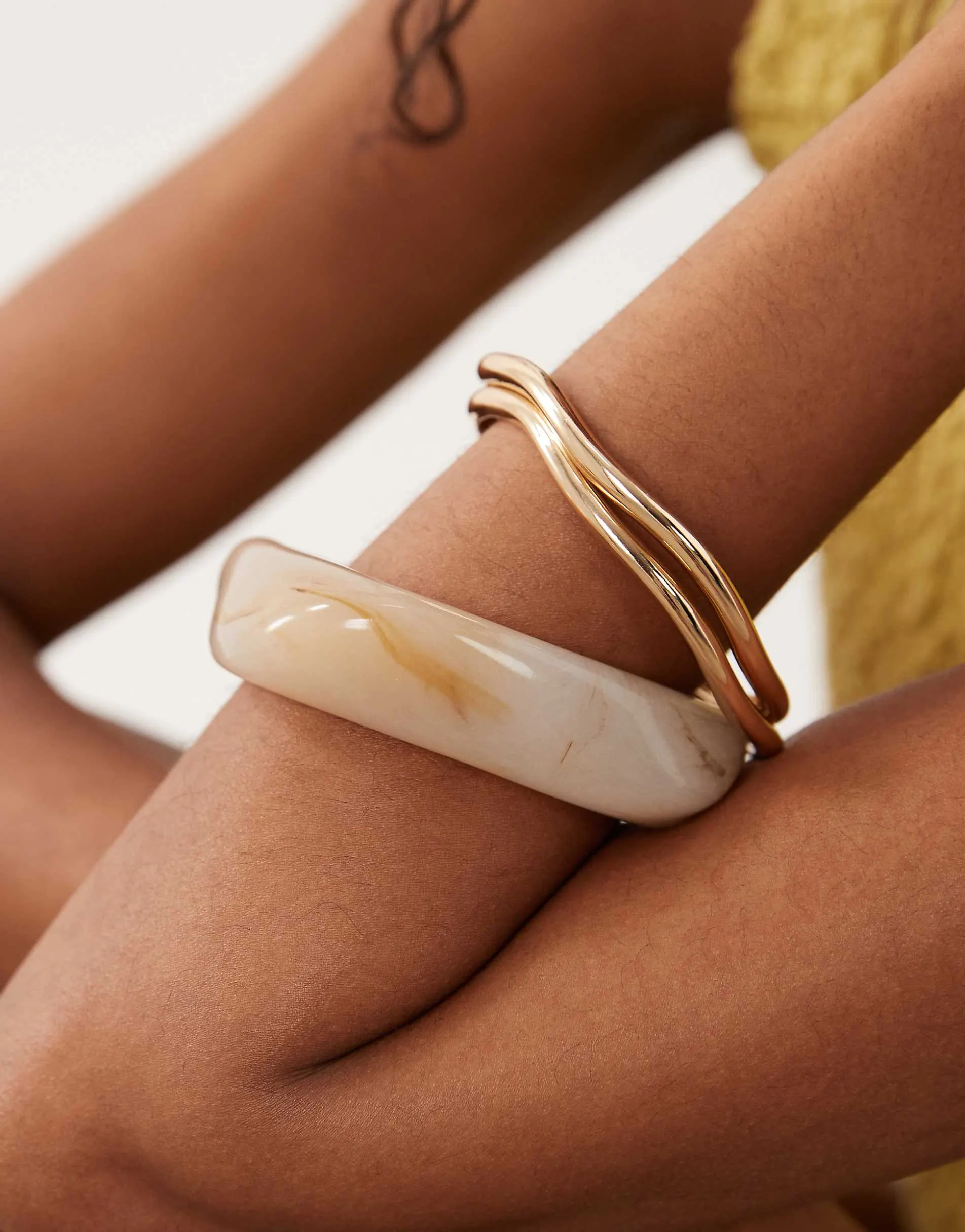 ASOS DESIGN 3 pack of bangles in natural resin and gold tone