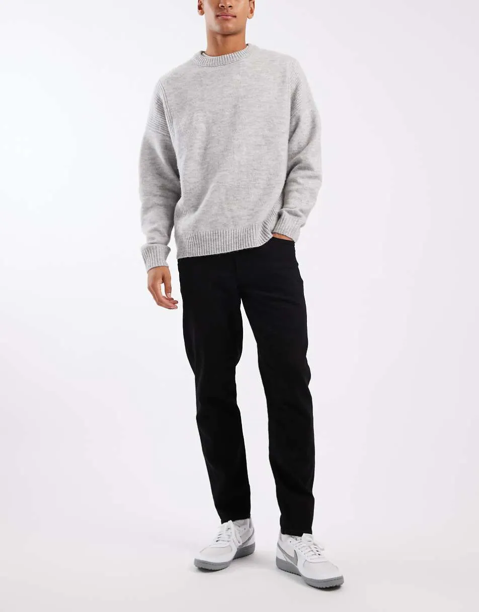 ASOS DESIGN tapered jeans in black