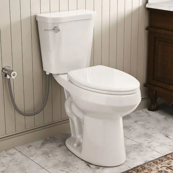 19 in.​ ADA Tall Toilet 2-​Piece Elongated Bowl in White, 1.​28 GPF Single Flush & Soft-​Close Seat, S-​Trap 12 in.​ Rough-​in
