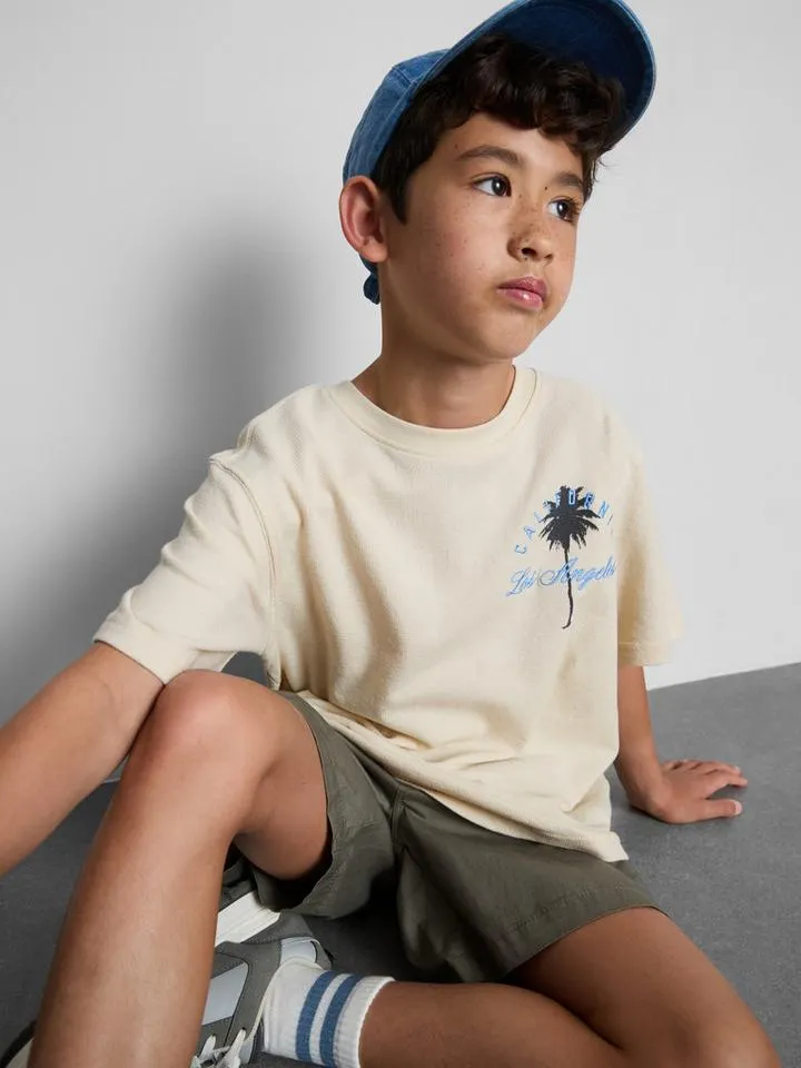 7–15 ans | T-shirt texturé à motif palmier