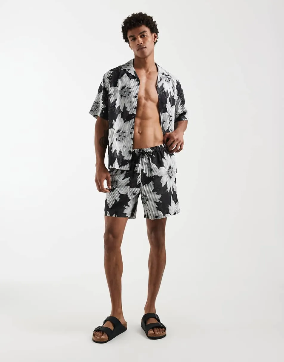 ASOS DESIGN co-ord swim shorts in mid length with floral print in black