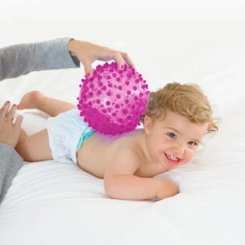 Bola sensorial rosa com espetos