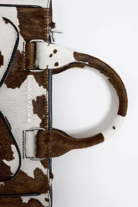 Mala tote Pocket M de pele com print de vaca