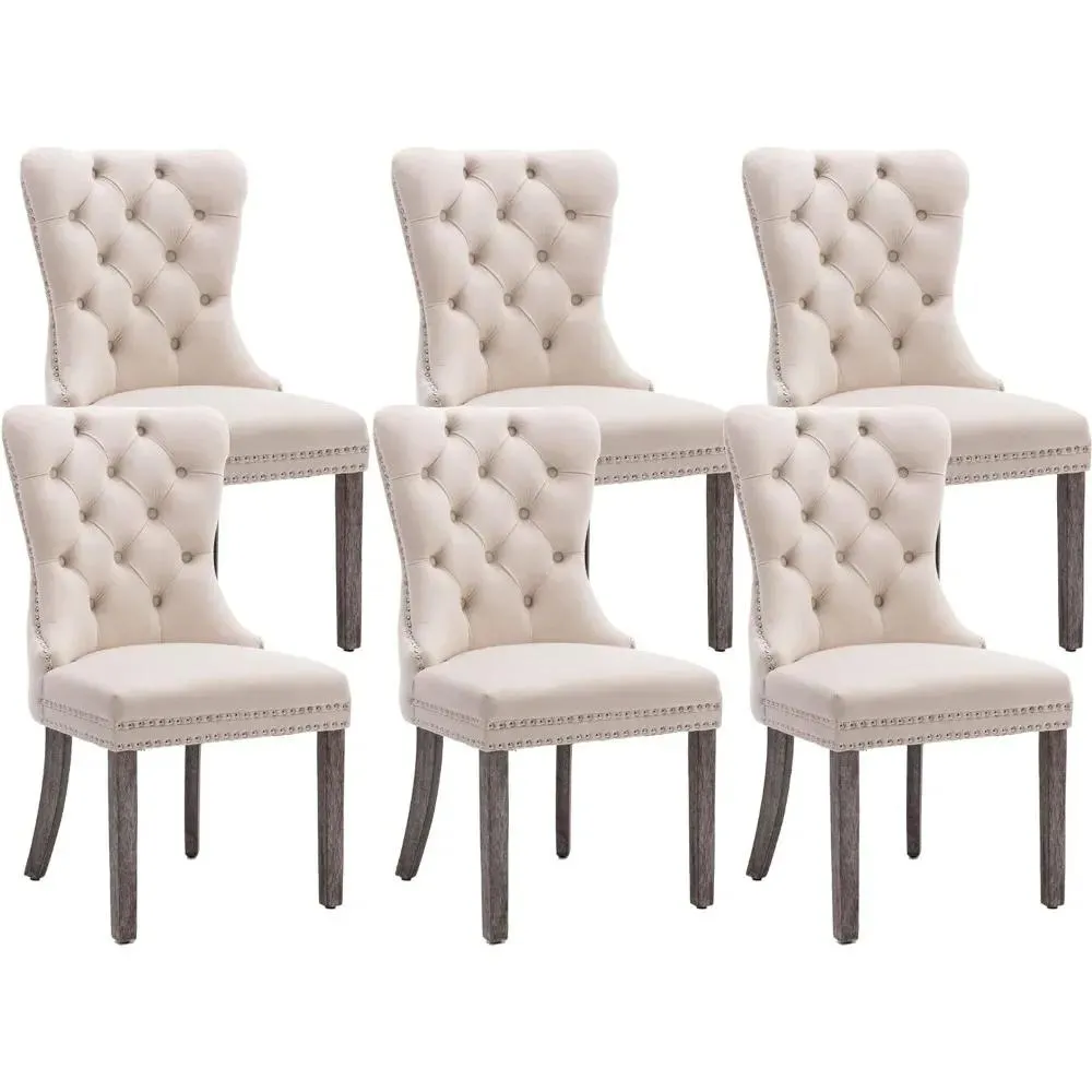 A set of 6 beige velvet dining chairs, soft cushioned plush chairs with nail heads and solid wood legs with loop edges
