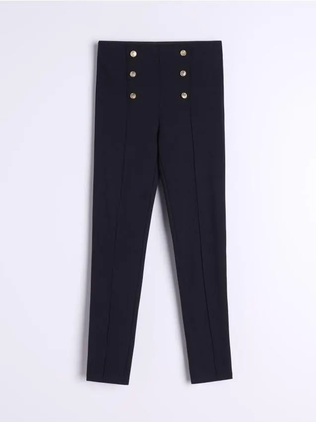 Pantaloni cu nasturi decorativi