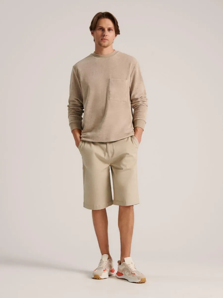 Bluză sport cu margini ripsate