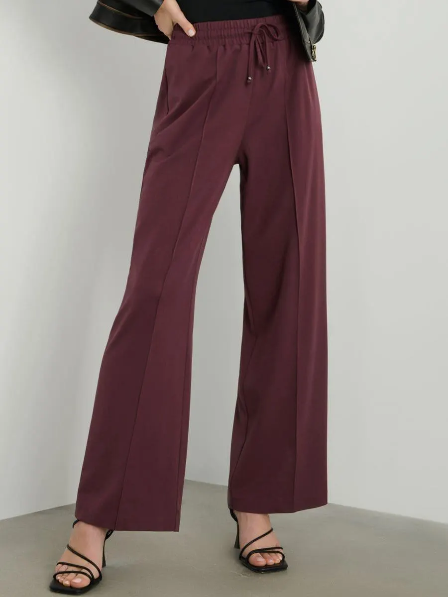 Pantaloni cu craci largi