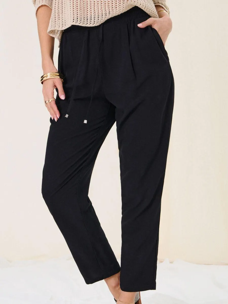 Pantaloni cu croi conic