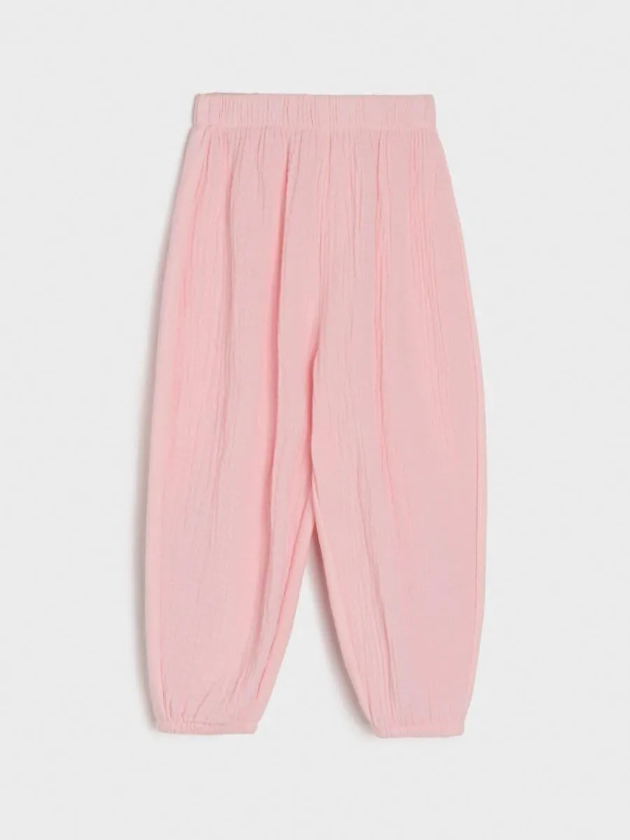 Pantaloni din materiale combinate