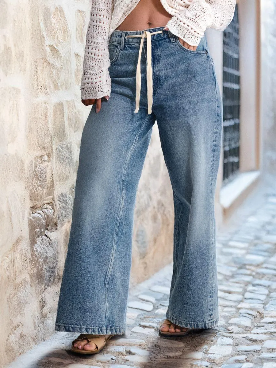 Blugi cu crac larg și talie înaltă