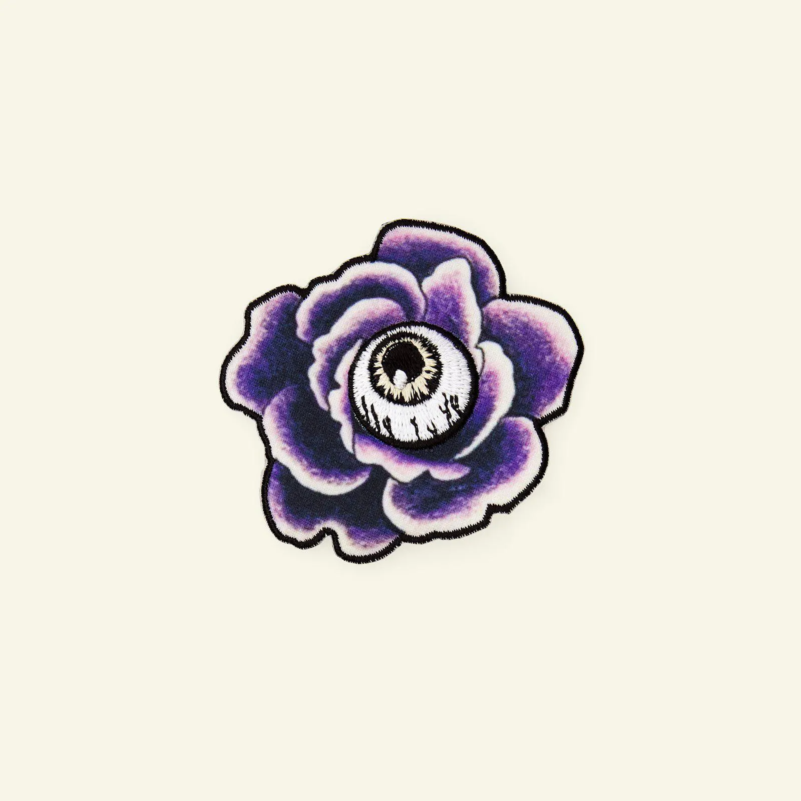 Symärke blomma/öga 63x55mm svart/lila