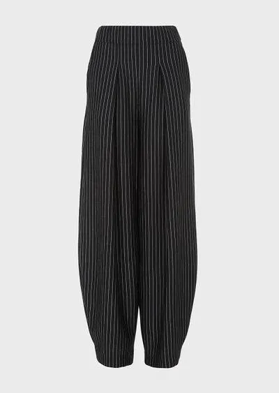 Wide trousers in pinstriped cashmere jersey and silk