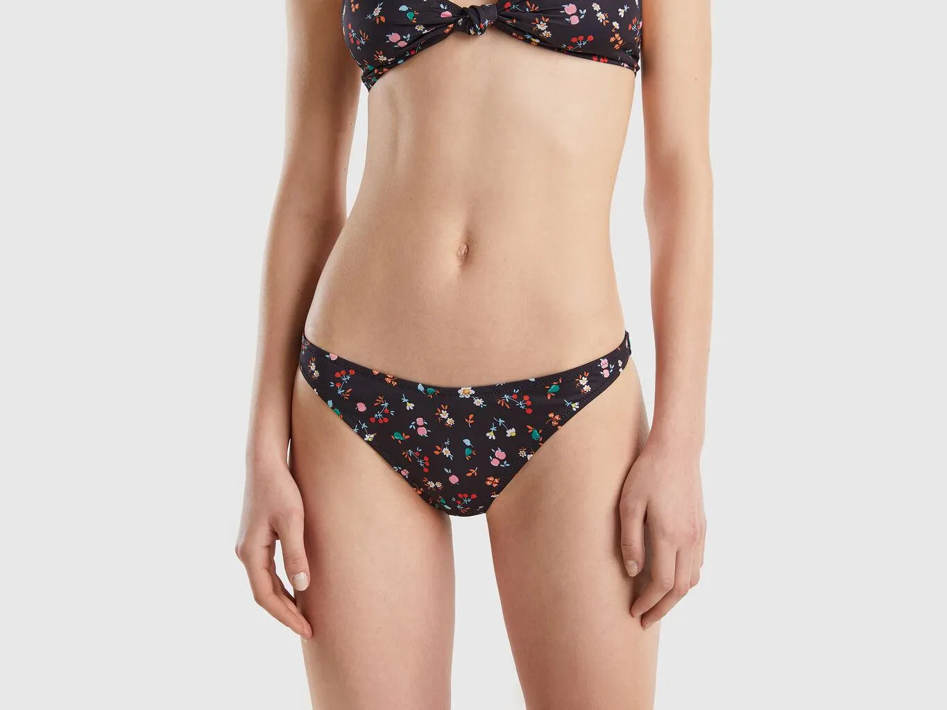 Black swim bottoms with floral print