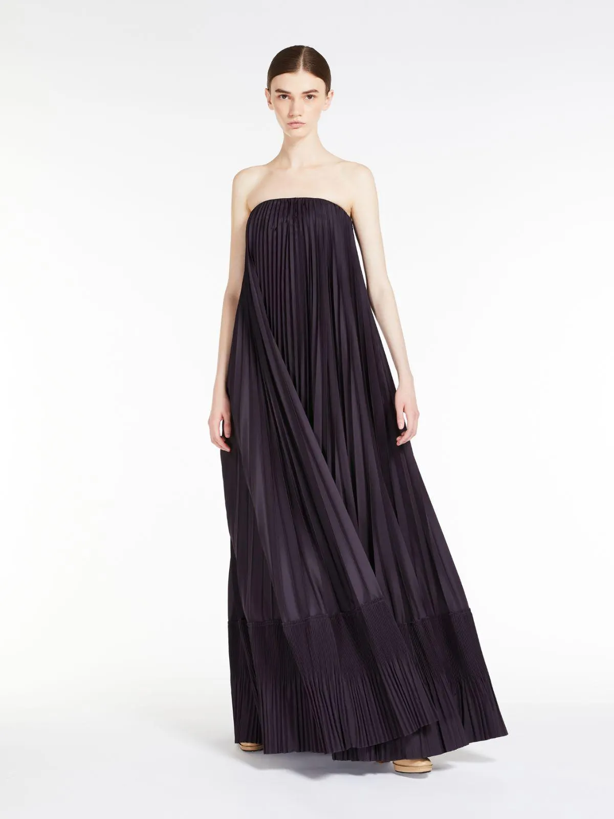 Dress in sunray-pleated fabric