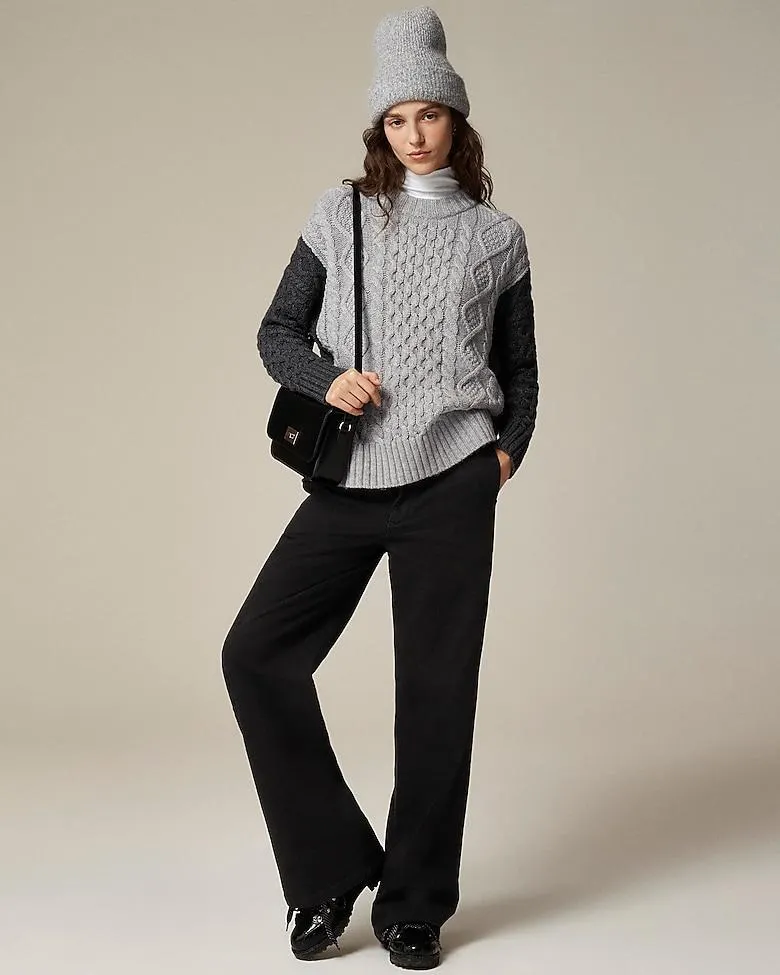 Oversized cable-knit crewneck sweater with contrast sleeves