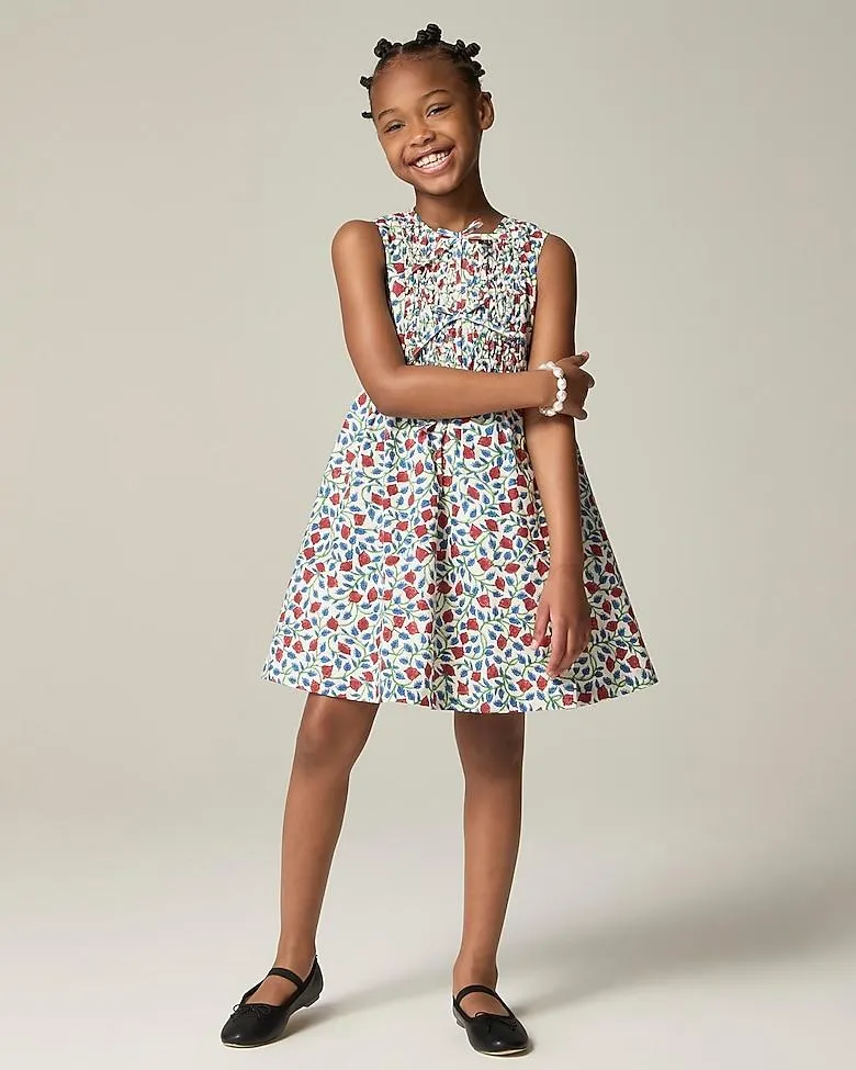 Girls' smocked floral dress with pearl embellishments