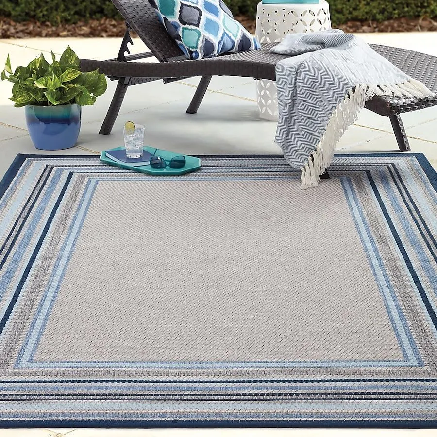 allen + roth with STAINMASTER Blue Border 8 x 10 (ft) Loomed Polypropylene Blue Rectangular Outdoor Area rug