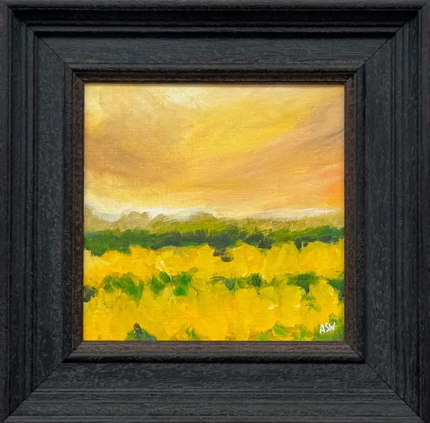 Angela Wakefield Golden yellow field at dusk beneath a glowing amber sky in English Countryside 2025